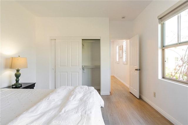 320 Bronze, Irvine, CA 92618 - bedroom featuring light wood finished floors and a closet