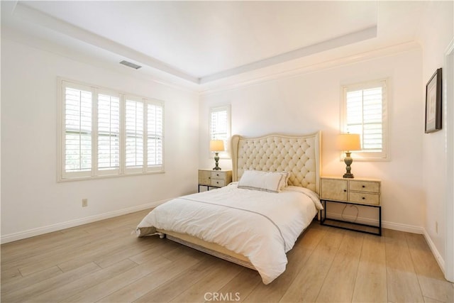 320 Bronze, Irvine, CA 92618 - bedroom featuring wood finished floors and a raised ceiling
