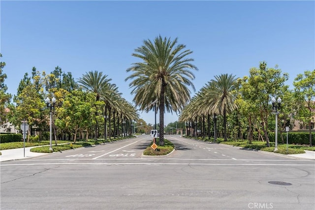320 Bronze, Irvine, CA 92618 - view of asphalt street featuring street lighting, traffic signs, curbs, and sidewalks