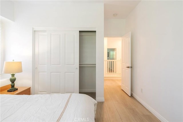320 Bronze, Irvine, CA 92618 - bedroom featuring light wood finished floors and a closet