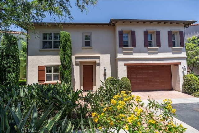 320 Bronze, Irvine, CA 92618 - view of front of house with stucco siding, an attached garage, and driveway
