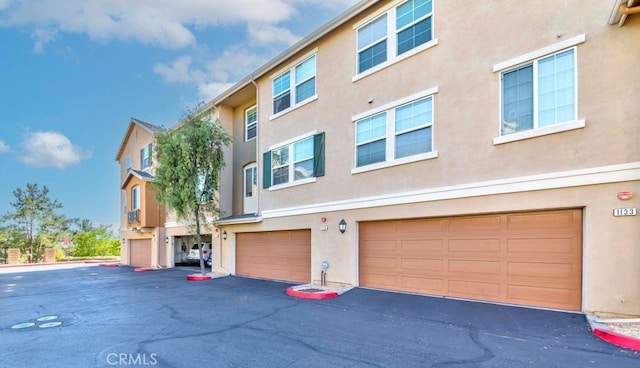 1133 Maag Pl Unit 107, Fullerton, CA 92833 - view of property with an attached garage