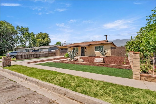 1446 Morgan Rd, San Bernardino, CA 92407 - single story home with concrete driveway, stucco siding, and an attached garage