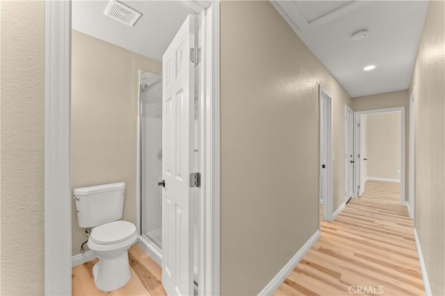 1446 Morgan Rd, San Bernardino, CA 92407 - hallway featuring light wood-style flooring and attic access