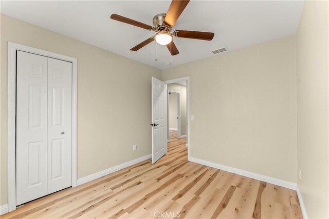 1446 Morgan Rd, San Bernardino, CA 92407 - unfurnished bedroom with light wood-type flooring, a closet, and ceiling fan
