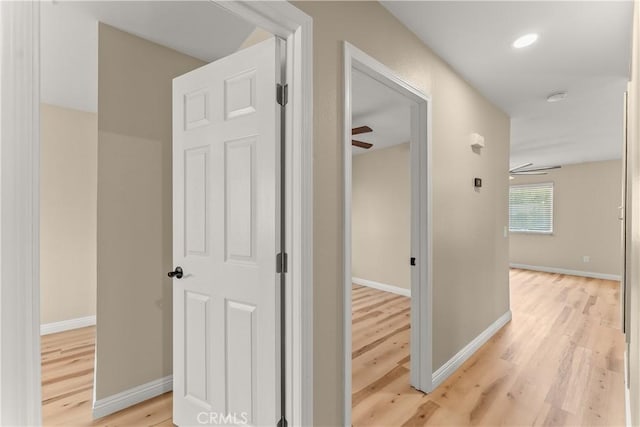 1446 Morgan Rd, San Bernardino, CA 92407 - hall featuring light wood-style flooring and baseboards