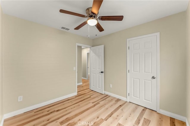 1446 Morgan Rd, San Bernardino, CA 92407 - unfurnished bedroom with light wood-style floors and ceiling fan
