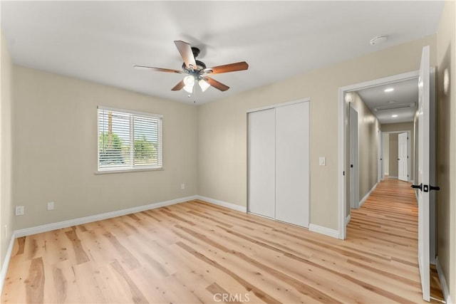1446 Morgan Rd, San Bernardino, CA 92407 - unfurnished bedroom featuring light wood finished floors, a closet, and a ceiling fan