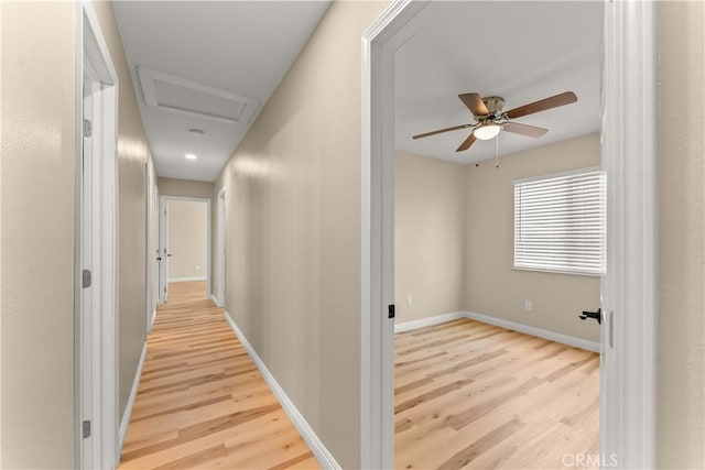 1446 Morgan Rd, San Bernardino, CA 92407 - corridor with light wood finished floors and attic access