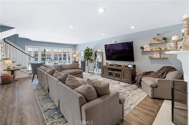 942 University Ave, Burbank, CA 91504 - living area featuring arched walkways, stairway, wood finished floors, recessed lighting, and french doors