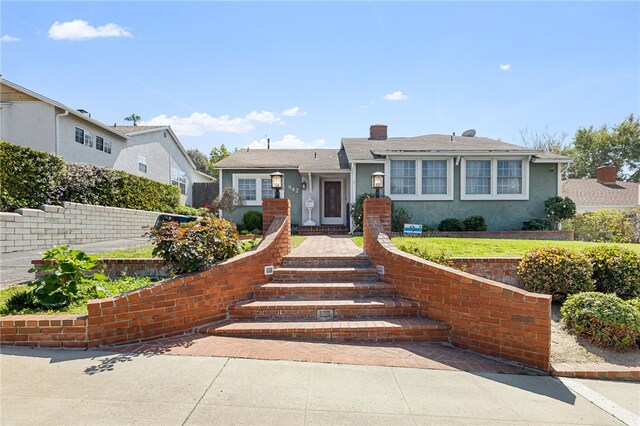 942 University Ave, Burbank, CA 91504 - view of front facade with stucco siding and a chimney