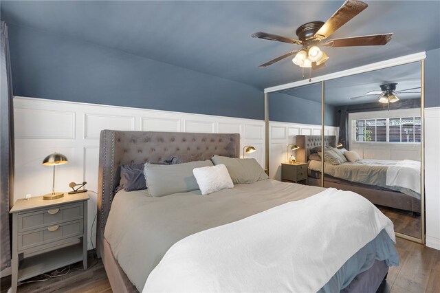 942 University Ave, Burbank, CA 91504 - bedroom with wood finished floors, ceiling fan, and a decorative wall
