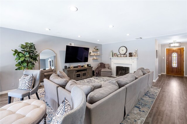 942 University Ave, Burbank, CA 91504 - living room with arched walkways, wood finished floors, recessed lighting, and a fireplace