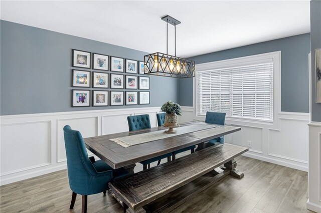 942 University Ave, Burbank, CA 91504 - dining room with a decorative wall, light wood-style flooring, and wainscoting