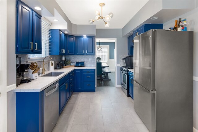 942 University Ave, Burbank, CA 91504 - kitchen with appliances with stainless steel finishes, blue cabinets, a chandelier, light countertops, and recessed lighting