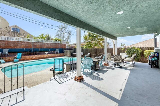 942 University Ave, Burbank, CA 91504 - view of swimming pool featuring outdoor dining area, a fenced backyard, and a patio area
