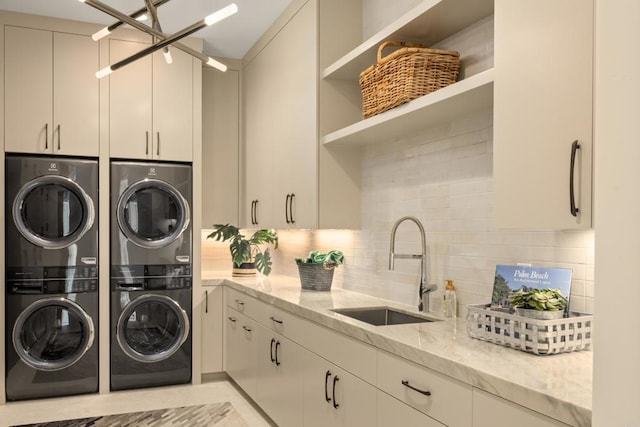 7888 Muirfield Way, Rancho Santa Fe, CA 92067 - laundry room featuring estacked washer and dryer and cabinet space