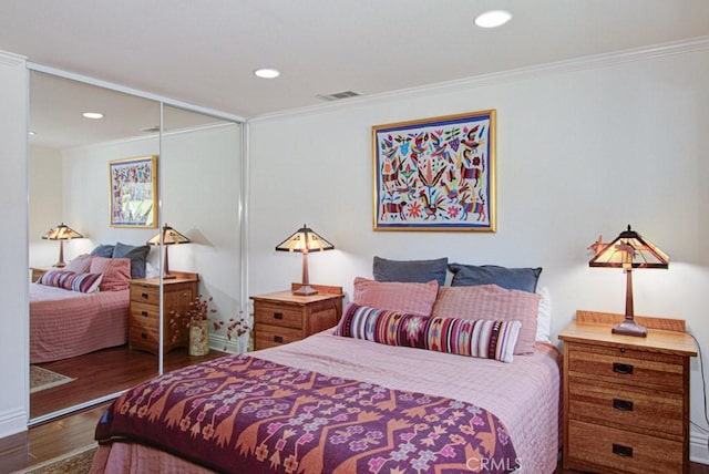 3179 Alta Vis Unit A, Laguna Woods, CA 92637 - bedroom featuring a closet, wood finished floors, ornamental molding, and recessed lighting