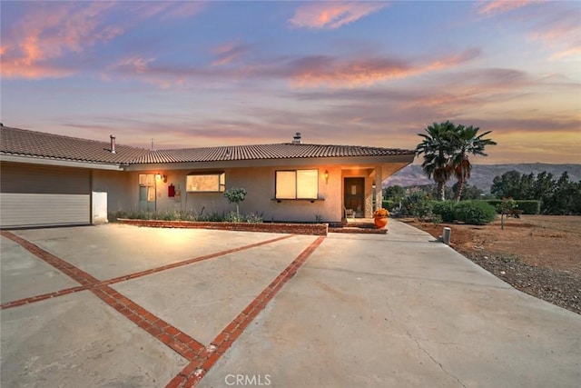 6020 Valley Sage Rd, Acton, CA 93510 - view of front of house with driveway, stucco siding, a garage, and a tiled roof