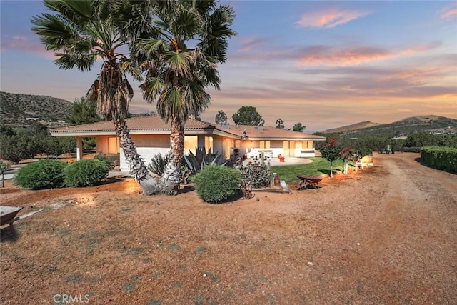 6020 Valley Sage Rd, Acton, CA 93510 - view of front facade featuring stucco siding, a mountain view, a patio, and a tiled roof