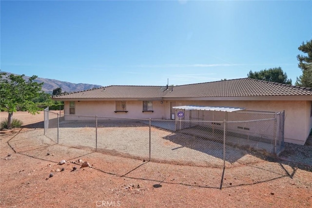 6020 Valley Sage Rd, Acton, CA 93510 - back of property featuring stucco siding, a tiled roof, and a mountain view