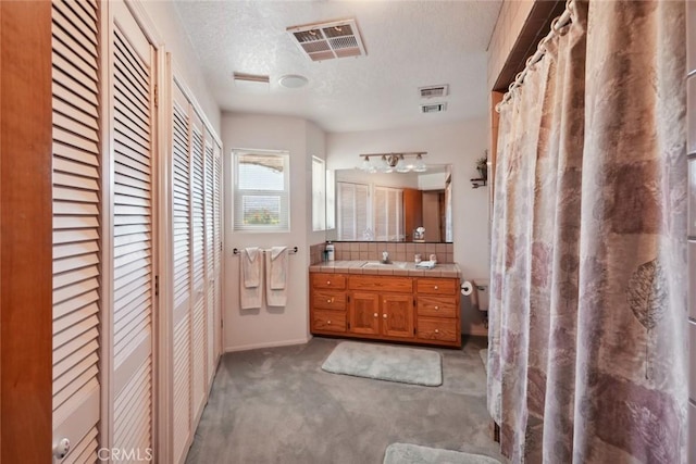 6020 Valley Sage Rd, Acton, CA 93510 - full bath featuring a closet, vanity, and a textured ceiling