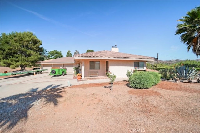 6020 Valley Sage Rd, Acton, CA 93510 - ranch-style home featuring a chimney, stucco siding, and a tile roof