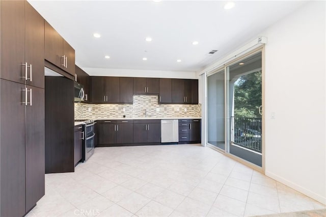16 Agave, Lake Forest, CA 92630 - kitchen with stainless steel appliances, tasteful backsplash, light countertops, dark brown cabinets, and recessed lighting