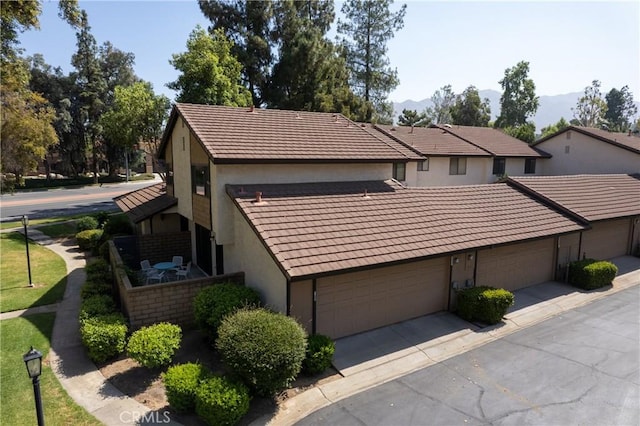 779 Via Sierra Nevada, Riverside, CA 92507 - view of side of property featuring stucco siding, a tile roof, and a mountain view