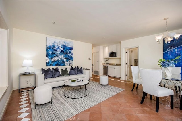 1129 Via Mirabel, Palos Verdes Estates, CA 90274 - living room featuring a chandelier and light tile patterned floors