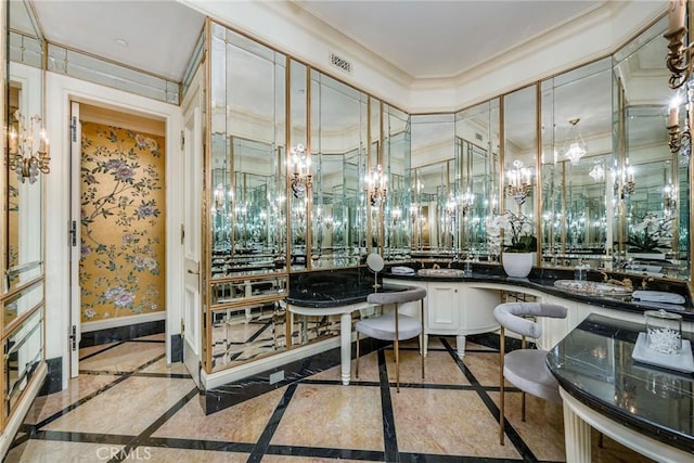 1129 Via Mirabel, Palos Verdes Estates, CA 90274 - bar area with inlaid floor details, a chandelier, and ornamental molding
