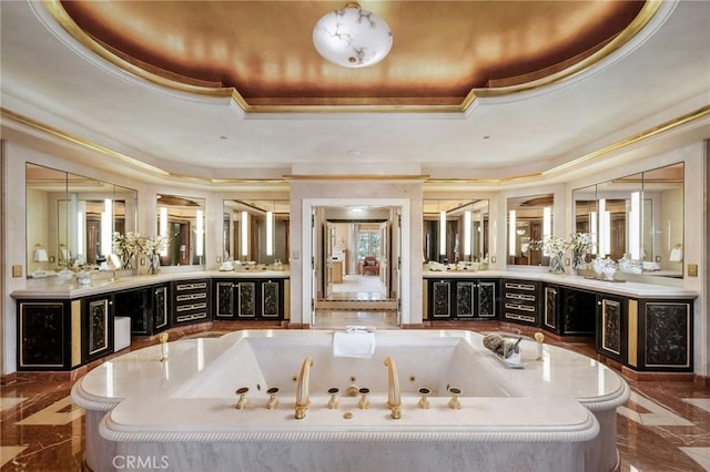 1129 Via Mirabel, Palos Verdes Estates, CA 90274 - bathroom featuring a tray ceiling, marble tiled flooring, a jetted tub, vanity, and ornamental molding