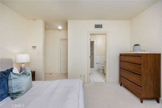 1129 Via Mirabel, Palos Verdes Estates, CA 90274 - bedroom featuring light carpet, ensuite bath, and light tile patterned flooring