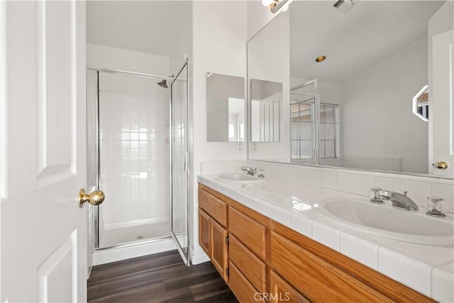 27545 Wellsley Way, Valencia, CA 91354 - bathroom featuring a shower stall, double vanity, and wood finished floors