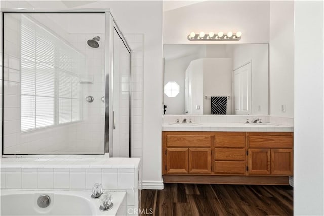 27545 Wellsley Way, Valencia, CA 91354 - bathroom with a stall shower, a bath, double vanity, and wood finished floors