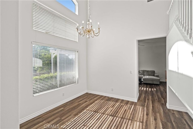 27545 Wellsley Way, Valencia, CA 91354 - unfurnished dining area with a chandelier, wood finished floors, and a high ceiling
