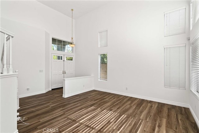 27545 Wellsley Way, Valencia, CA 91354 - unfurnished room with dark wood-type flooring and a towering ceiling
