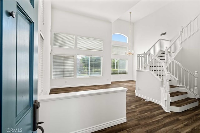 27545 Wellsley Way, Valencia, CA 91354 - foyer entrance with a towering ceiling, wood finished floors, stairway, and a chandelier