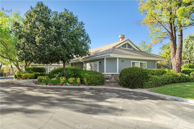 27545 Wellsley Way, Valencia, CA 91354 - view of property exterior featuring stone siding