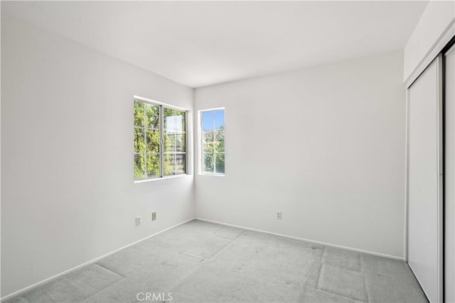 27545 Wellsley Way, Valencia, CA 91354 - unfurnished bedroom featuring light carpet and a closet