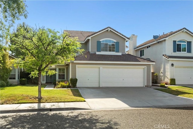 27545 Wellsley Way, Valencia, CA 91354 - traditional-style house with a garage, concrete driveway, and a front lawn