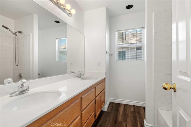 27545 Wellsley Way, Valencia, CA 91354 - full bathroom with double vanity, wood finished floors, and shower / washtub combination