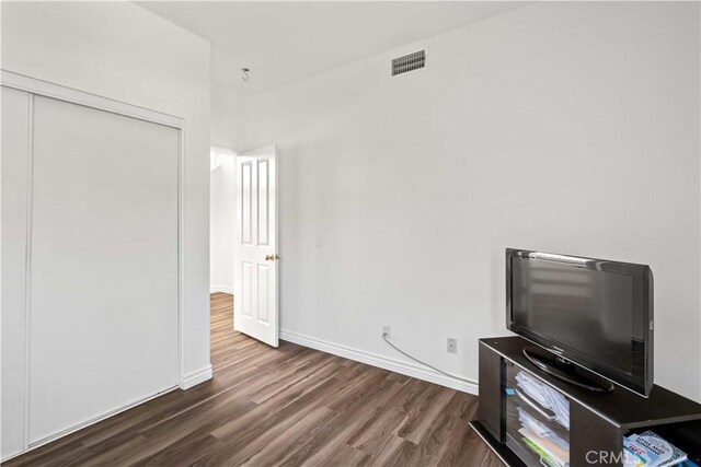 27545 Wellsley Way, Valencia, CA 91354 - unfurnished living room with dark wood-style floors and baseboards