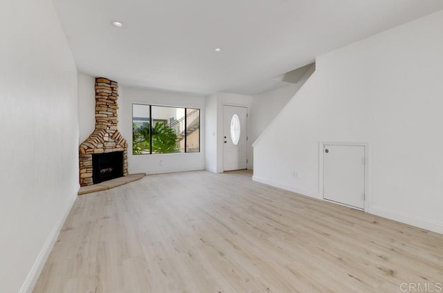 3414 Del Este Way, Oceanside, CA 92056 - unfurnished living room with wood finished floors, recessed lighting, and a fireplace