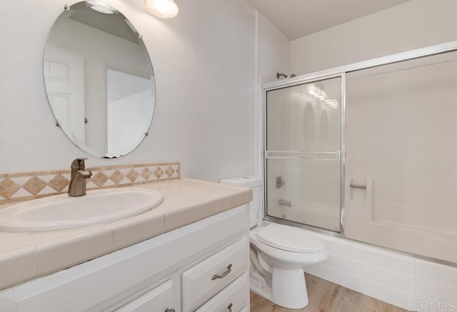 3414 Del Este Way, Oceanside, CA 92056 - full bathroom featuring vanity, enclosed tub / shower combo, and wood finished floors