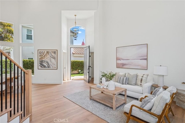 38 San Raphael, Dana Point, CA 92629 - living room featuring a high ceiling, light wood-type flooring, and stairs