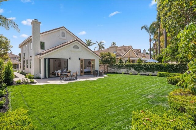 38 San Raphael, Dana Point, CA 92629 - back of property with stucco siding, a patio area, and a chimney