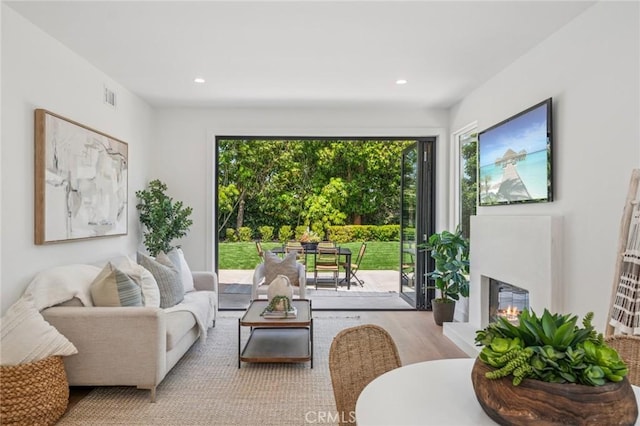 38 San Raphael, Dana Point, CA 92629 - living room with wood finished floors, a glass covered fireplace, and recessed lighting