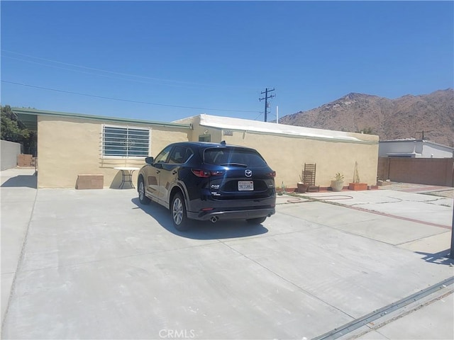 15845 La Vida Dr, Palm Springs, CA 92262 - view of home's exterior with a mountain view and stucco siding