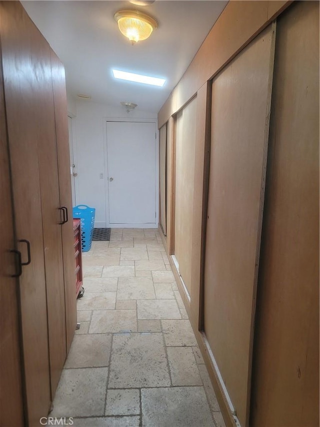 15845 La Vida Dr, Palm Springs, CA 92262 - hallway featuring stone tile floors and baseboards